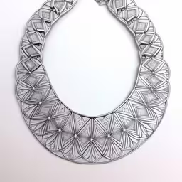 the artful necklace has two circles and four diamonds,an intricate metal frame made of decorative shapes,a metal chain that has been shaped into a necklace,a metal choker on a wall in an artistic setting,this silver metal bib is hanging on the wall