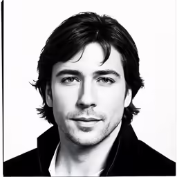 a man is wearing black shirt and black jacket