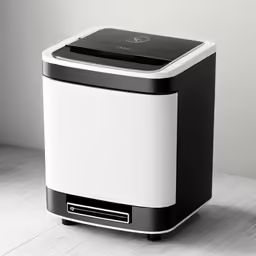 a white and black compact device sitting on a table