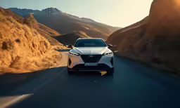 a silver nissan concept car is driving down the road