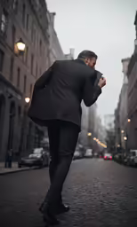 a man in a suit walking down the street