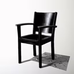 a black chair sitting on top of a white floor