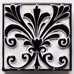 a white and black piece of art on display,decorative black and white design that is part of an artful tile