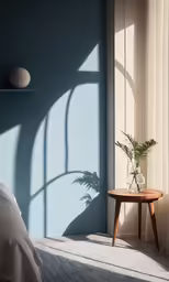 a small bedroom has blue walls and a wooden table