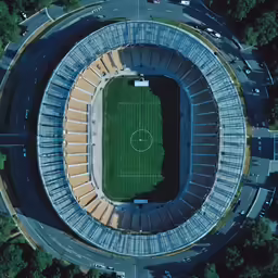 an aerial view of a stadium with a soccer field