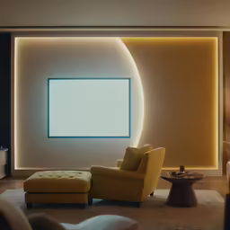 a living room with a yellow chair and ottoman