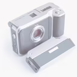 a compact camera on display on a white background