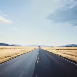 there is an empty empty highway that is in the middle of nowhere
