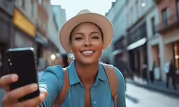 a woman takes a selfie with her cellphone