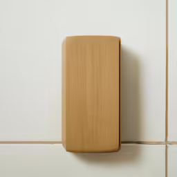 a small wood box mounted to the side of a wall