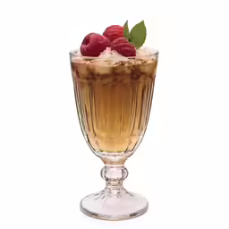 a dessert in a glass that is full of ice and raspberries
