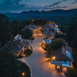 night view of houses in the mountains near a highway