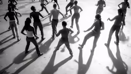 people in different poses dance on the ground