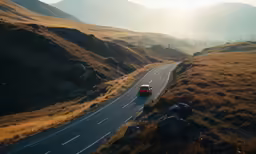 two trucks driving on the highway in between two hills