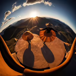 two people with umbrellas stand on a concrete surface