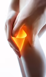 an image of a person holding their knee with a piece of flesh