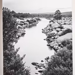 an image of an outdoor setting with rocks and water