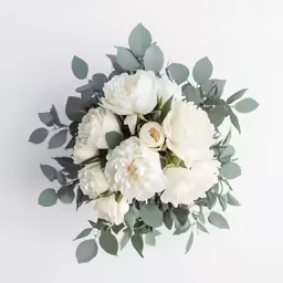 white flowers are arranged in the middle of the bouquet
