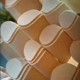 several stacks of round, white objects stacked on each other