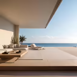 a very long and empty living room overlooks a nice beach