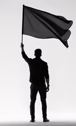 silhouette of man holding flag with arms raised
