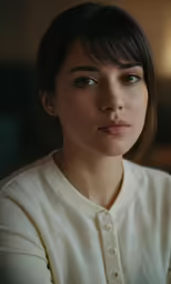 a beautiful young woman looking into the camera