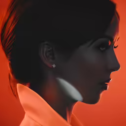 a woman with earrings on her head in front of an orange background