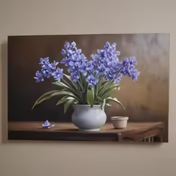 blue flowers are in a white vase on a table
