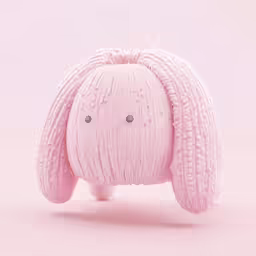 pink bunny sculpture with three dots in the center and two rows at the sides of its head
