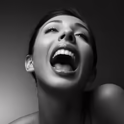 a woman with her face open and an opening tongue