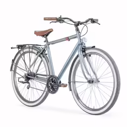 the bicycle is standing upright against the white background