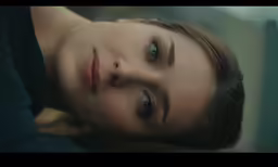 an image of a woman looking back at camera