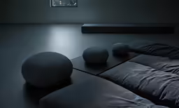a living room with couches, tables and a tv