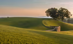 an old stone bench sitting in the grass