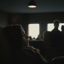 a woman looks intently into the distance while she waits for someone