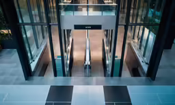 an open elevator and some doors on the outside