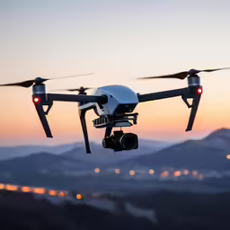 a large black and white model flying over mountains