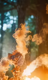a close up of some red and orange smoke coming out of a candle