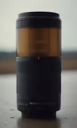 a lens with a coffee cup on the top