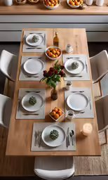 the table set for a meal is set with plates and bowls