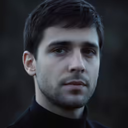 this is an image of a man with an artistic look on his face