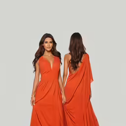 two women in dresses with capes on one, and a brown one
