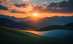 a valley and its lake surrounded by a sun set