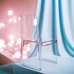 a plastic chair with lights in the background