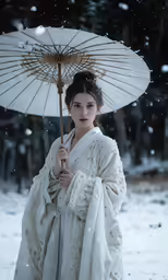 a lady holding an umbrella and wearing a white outfit
