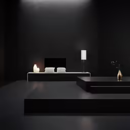a modern couch with black walls and a white floor