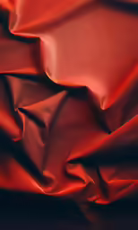 an extremely large red cloth with the silky folds