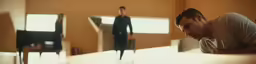 a man standing in front of a mirror and a woman behind him