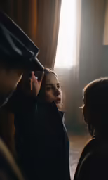 a woman adjusting a coat while another woman looks in