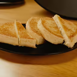 three slices of toast sitting on a plate